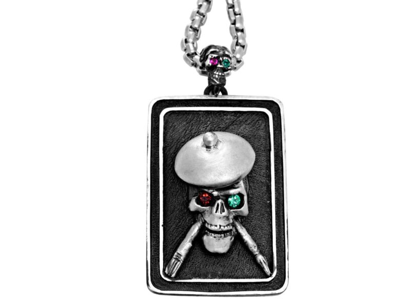 DT104-B The Artist Skull Dog Tag in Sterling Silver with Tsavorite and Ruby, designed by Steve Soffa