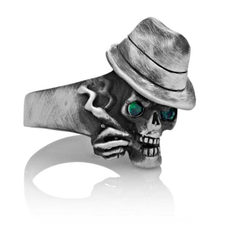 RG100-B The Gangster Skull Ring (Front Side View) in Sterling Silver with Green Stones, designed by Steve Soffa