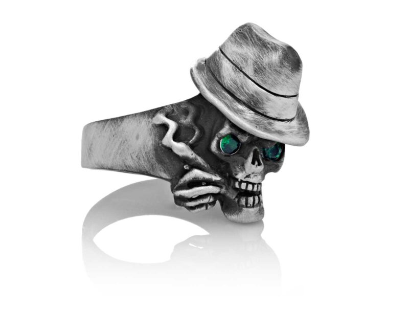 RG100-B The Gangster Skull Ring (Front Side View) in Sterling Silver with Green Stones, designed by Steve Soffa