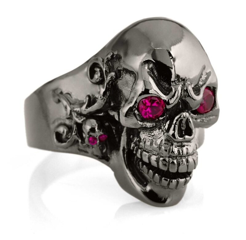 RG102-BK-RD The Player skull ring is cast in 20 grams 999 rhodium plated Sterling Silver with red stones. From the Black Collection, designed by Steve Soffa