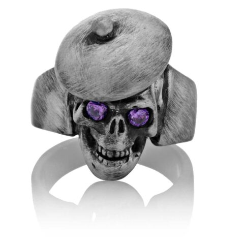 RG104-A The Artist Skull Ring (Front View) in Sterling Silver with Plum Stones, designed by Steve Soffa