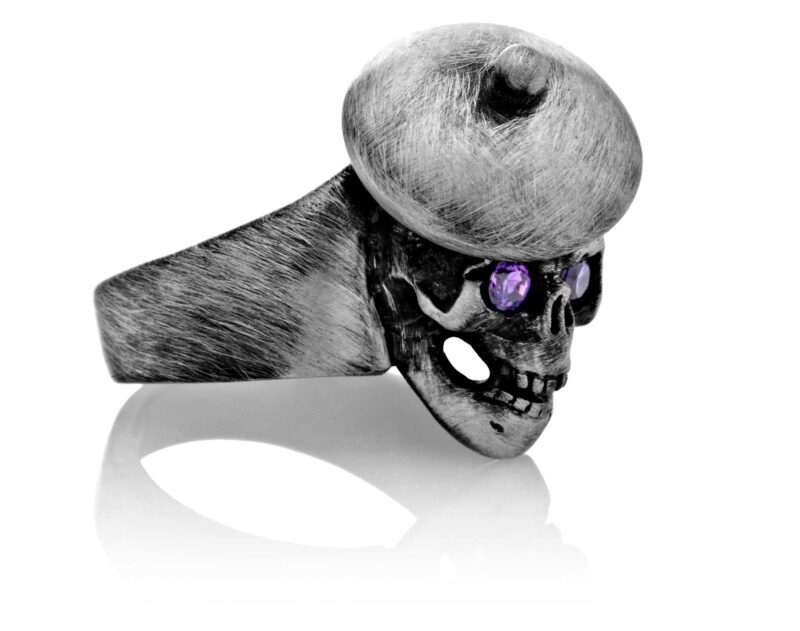 RG104-A The Artist Skull Ring (Front Right Side View) in Sterling Silver with Plum Stones, designed by Steve Soffa