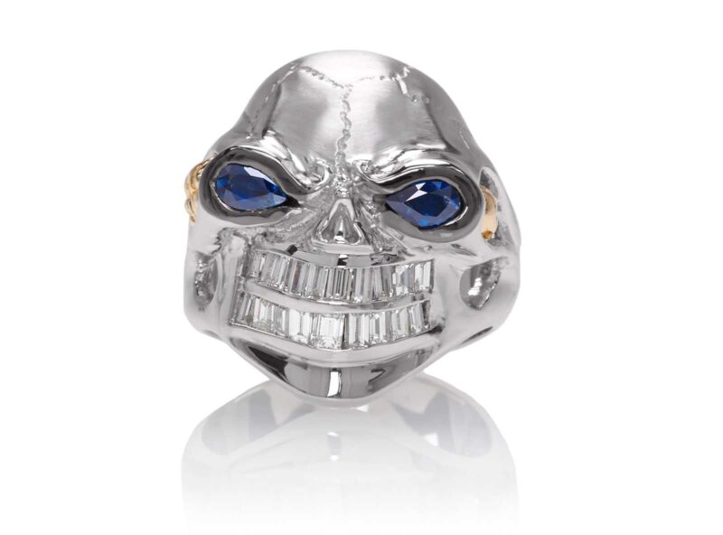 RG3020WH-B Monstrous Max Skull Ring (Front View) in White Gold Blue Sapphire eyes, designed by Steve Soffa