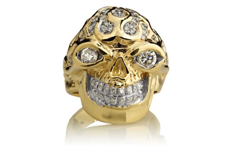 RG3022YG-A Blazing Bruno Skull Ring (Front View) in Yellow Gold with White Diamonds, designed by Steve Soffa