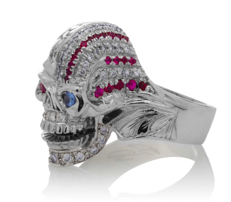 RG1006 The Freedom Rider Jewelry Skull Ring (Left Side) in White Gold with White Diamonds, Red Rubies and Blue Sapphire (Diamond Collection), designed by Steve Soffa