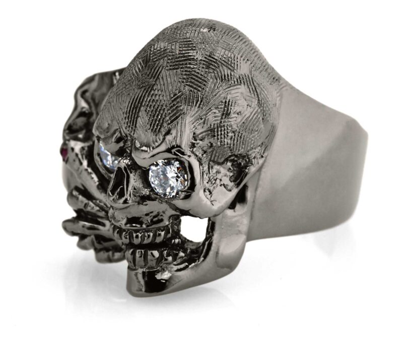 RG100BK-WHT The Clarence Catskills skull ring is cast in 27 grams 999 Sterling Silver with white synthetic stones, designed by Steve Soffa.