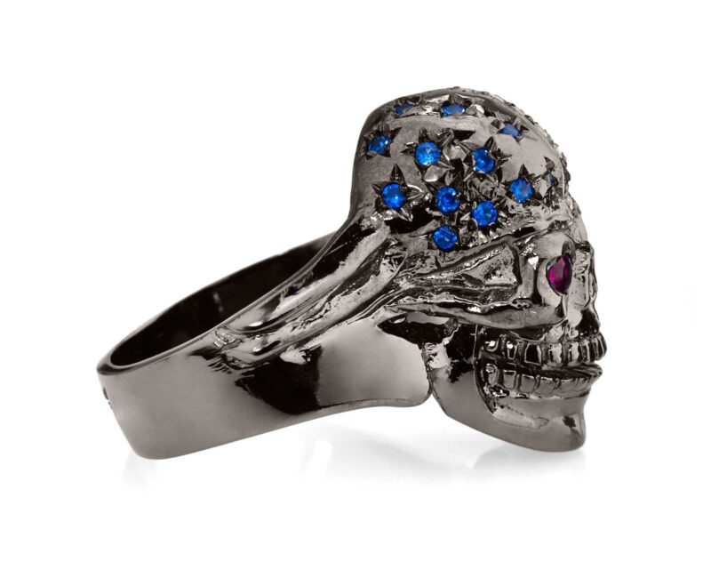 RG106BK-RD The Freedom Rider Skull Ring (Right View) in Rhodium Plated Sterling Silver in Blue Stones, with Blue, White & Red (Black Collection), designed by Steve Soffa