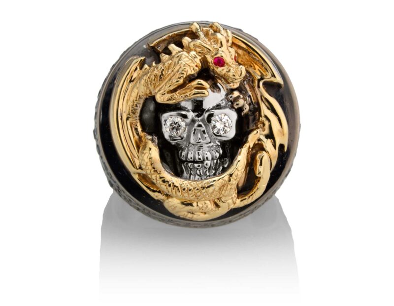 RG2508YG-WHT-BK-RD Dragon Of Deception Skull Ring (Front View) in Yellow Gold with White & Black Diamonds & Red Stones, designed by Steve Soffa