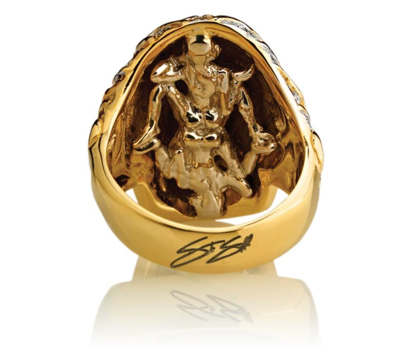 RG3022YG-A Blazing Bruno Skull Ring (Back View / Gallery) in Yellow Gold with White Diamonds, designed by Steve Soffa