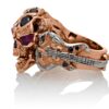 RG1008-A The Rock Star Skull Ring (Left Side View) in Rose/White Gold, with Black/White Diamonds and Rubies, designed by Steve Soffa