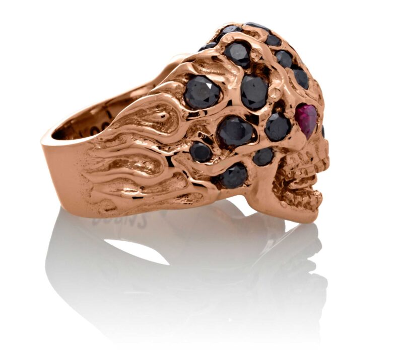 RG1008-A The Rock Star Skull Ring (Right Side View) in Rose/White Gold, with Black/White Diamonds and Rubies, designed by Steve Soffa