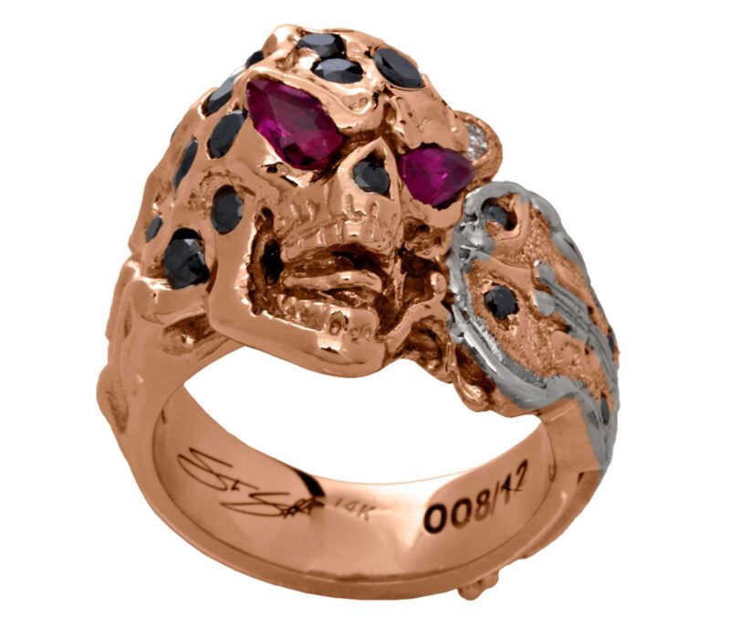 RG1008-A The Rock Star Skull Ring (Front Bottom View) in Rose/White Gold, with Black/White Diamonds and Rubies, designed by Steve Soffa