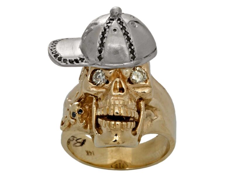 RG1002-A The Player Skull Ring (Front View) in Yellow and White Gold, with White and Black Diamonds, designed by Steve Soffa