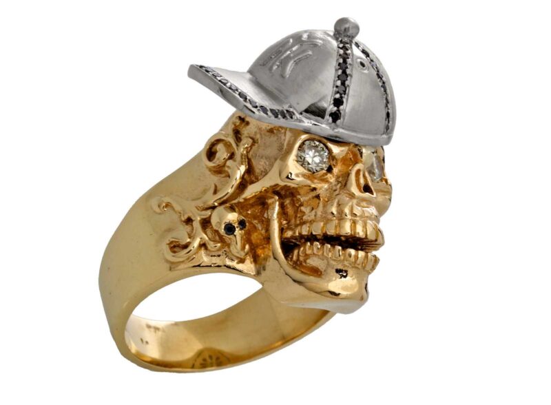 RG1002-A The Player Skull Ring (Front Right Side View) in Yellow and White Gold, with White and Black Diamonds, designed by Steve Soffa