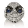 RG3028 Wicked Willy skull ring (Front View) in White Gold with White & Black Diamonds, Blue Sapphires, designed by Steve Soffa