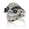 RG3028 Wicked Willy skull ring (Front Side View) in White Gold with White & Black Diamonds, Blue Sapphires, designed by Steve Soffa