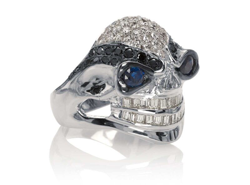 RG3028 Wicked Willy skull ring in White Gold with White & Black Diamonds, Blue Sapphires, designed by Steve Soffa