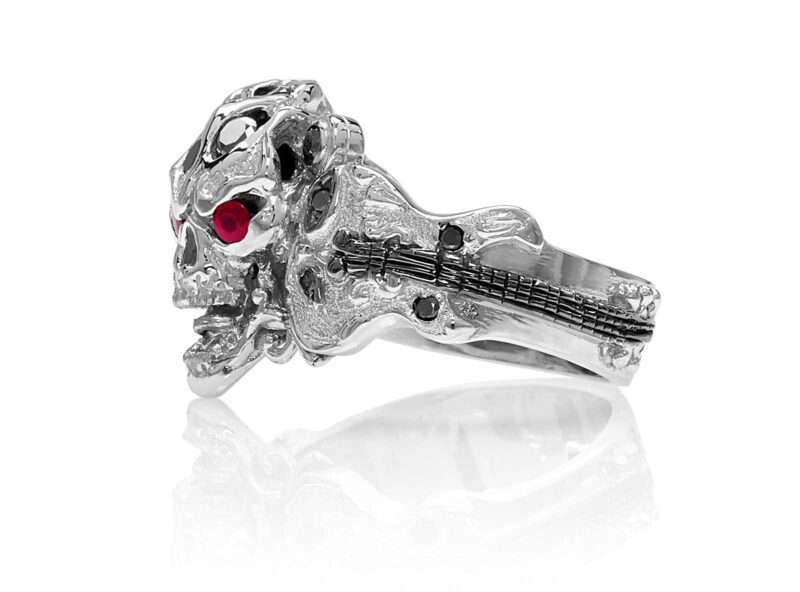 RG1008-B The Rock Star Skull Ring (Left Side View) in White Gold with Black Diamonds, White Diamonds and Rubies, designed by Steve Soffa