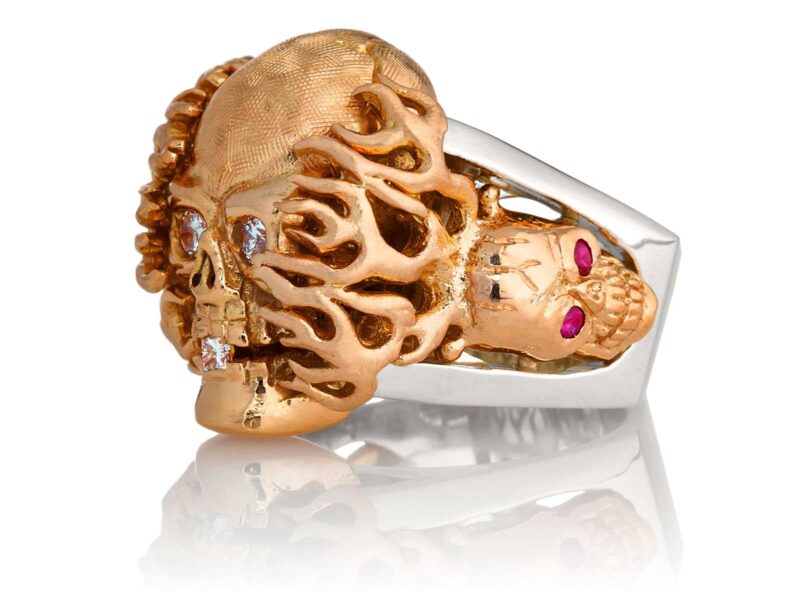 RG1020RGSIL Hot Head Harry Skull Ring (Left Side View) in Rose Gold and Silver with White Diamonds and Red Rubies, designed by Steve Soffa