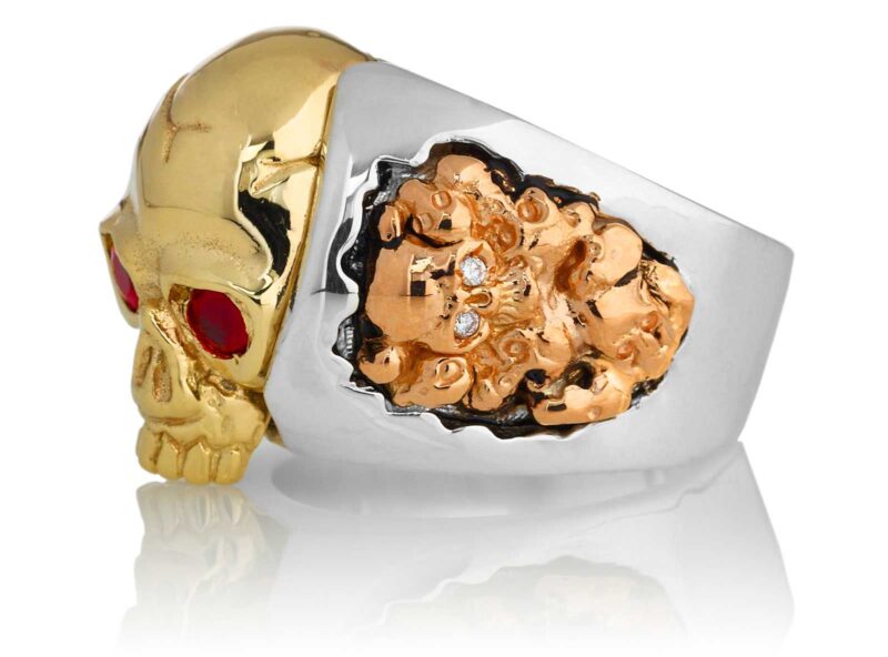 RG1030YGSIL-A Judge and Jury Skull Ring (Left Side View) in Yellow Gold and Sterling Silver with Rubies and White Diamonds, designed by Steve Soffa