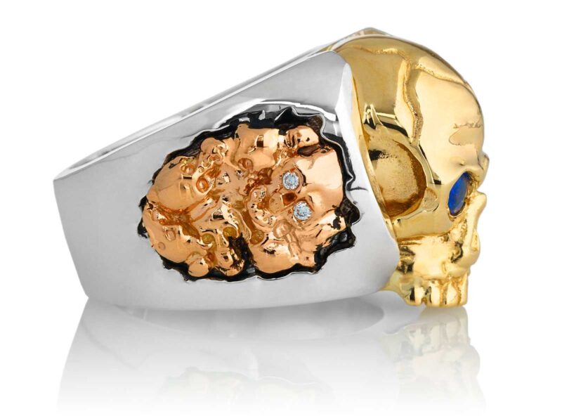 RG1030YGSIL-A Judge and Jury Skull Ring (Right Side View) in Yellow Gold and Sterling Silver with Rubies and White Diamonds, designed by Steve Soffa