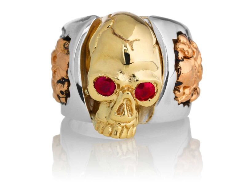 RG1030YGSIL-A Judge and Jury Skull Ring (Front View) in Yellow Gold and Sterling Silver with Rubies and White Diamonds, designed by Steve Soffa