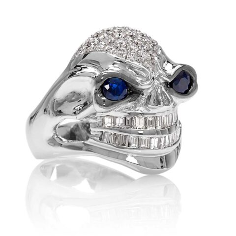 RG3026WG-A Vicious Vinnie Skull Ring (Front Side View) in White Gold with White Diamonds and Blue Sapphires, designed by Steve Soffa
