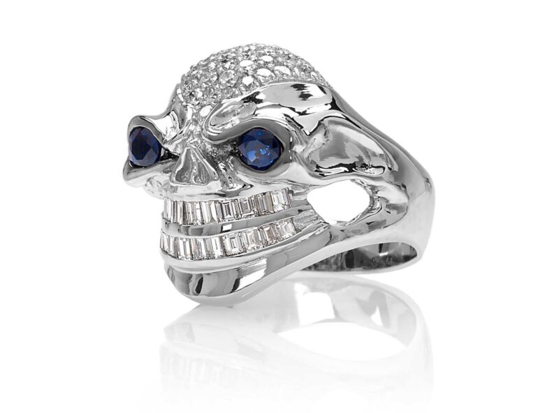 RG3026WG-A Vicious Vinnie Skull Ring (Front Side View) in White Gold with White Diamonds and Blue Sapphires, designed by Steve Soffa