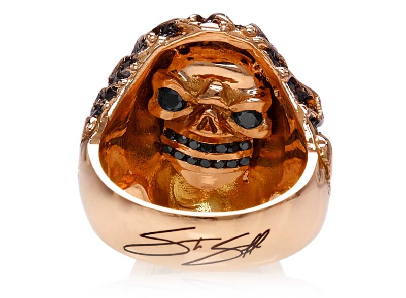 RG3022RG-A Blazing Bruno Skull Ring (Back View / Gallery) in Rose Gold with Black Diamonds, designed by Steve Soffa