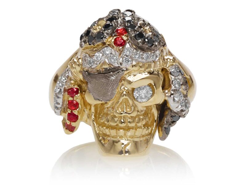 RG1042 Captain Morgan Men's Pirate Skull Ring (Front View) in Yellow Gold with White and Black Diamonds, with Orange Sapphires, designed by Steve Soffa