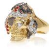 RG1042 Captain Morgan Men's Pirate Skull Ring (Front Left View) in Yellow Gold with White and Black Diamonds, with Orange Sapphires, designed by Steve Soffa