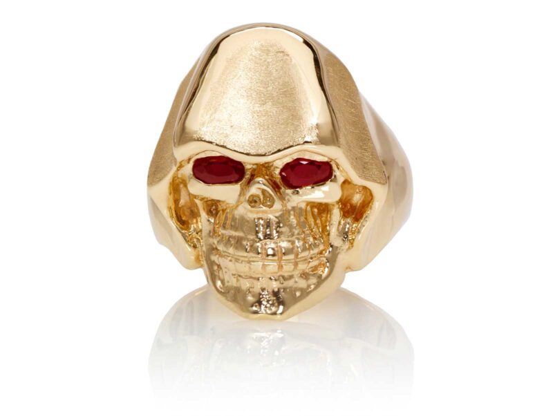 RG5010-A The Reaper Is In Skull Ring (Front View) Yellow with Rose Gold, with Red Rubies, designed by Steve Soffa