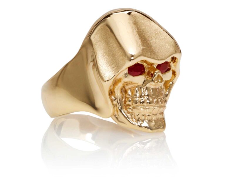 RG5010-A The Reaper Is In Skull Ring (Front Right Side View) Yellow with Rose Gold, with Red Rubies, designed by Steve Soffa