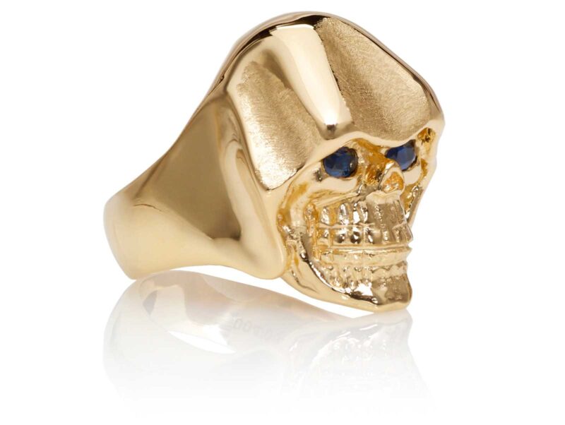 RG5010-B The Reaper Is In Skull Ring (Right Side Front View), Yellow with Rose Gold, with Blue Sapphires, designed by Steve Soffa