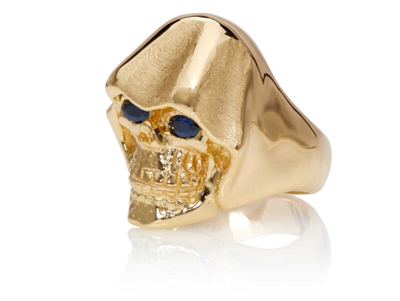 RG5010-B The Reaper Is In Skull Ring (Left Side Front View), Yellow with Rose Gold, with Blue Sapphires, designed by Steve Soffa